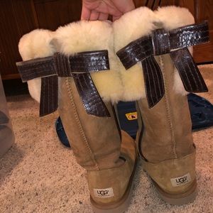 Tall UGG boots with leather bow in the back